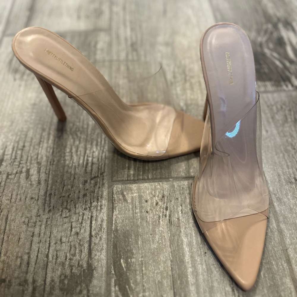 Clear pointed toe nude pump.
